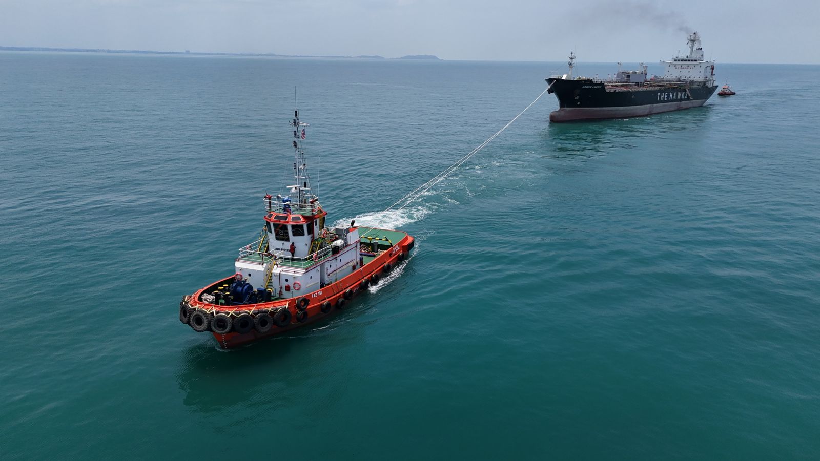 Don Maritime tug under way at speed, escorting at sea